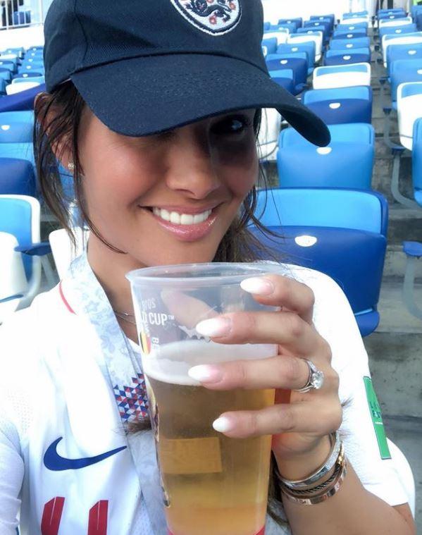 Rebekah Vardy looks in a good mood after learning her hubby Jamie is starting tonight as she enjoys a pint of beer