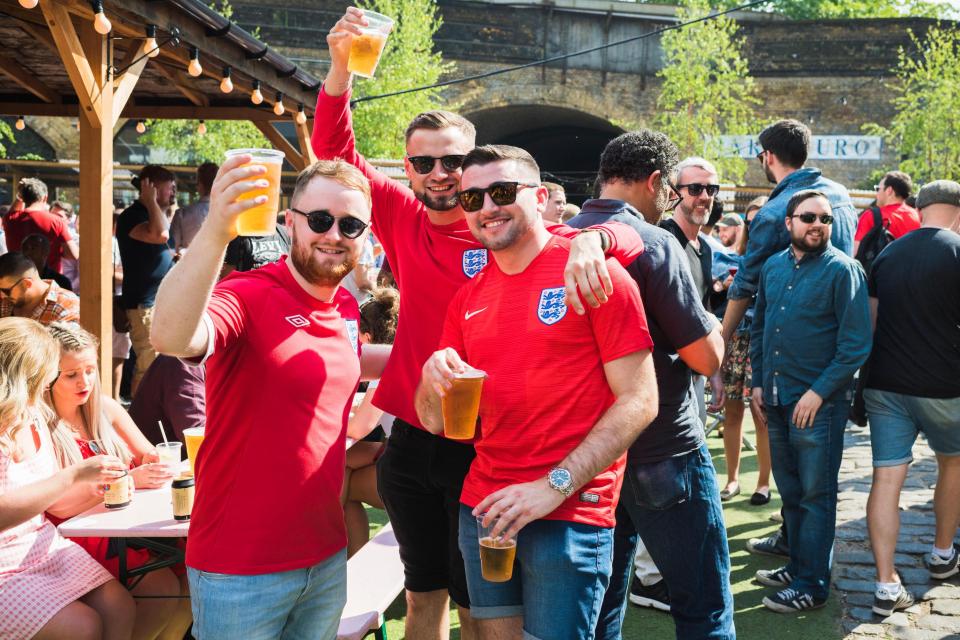 Fans at South London's Flat Iron Square get in a few beers before the England game kicks off in the blazing London sunshine