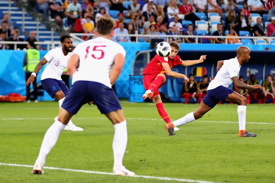 Adnan Januzaj curls the ball past Jordan Pickford to make it 1-0 to Belgium in Kaliningrad