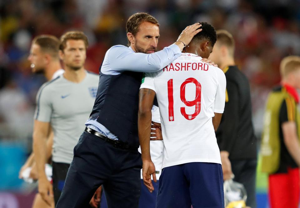 Gareth Southgate gives Marcus Rashford a hug after full-time