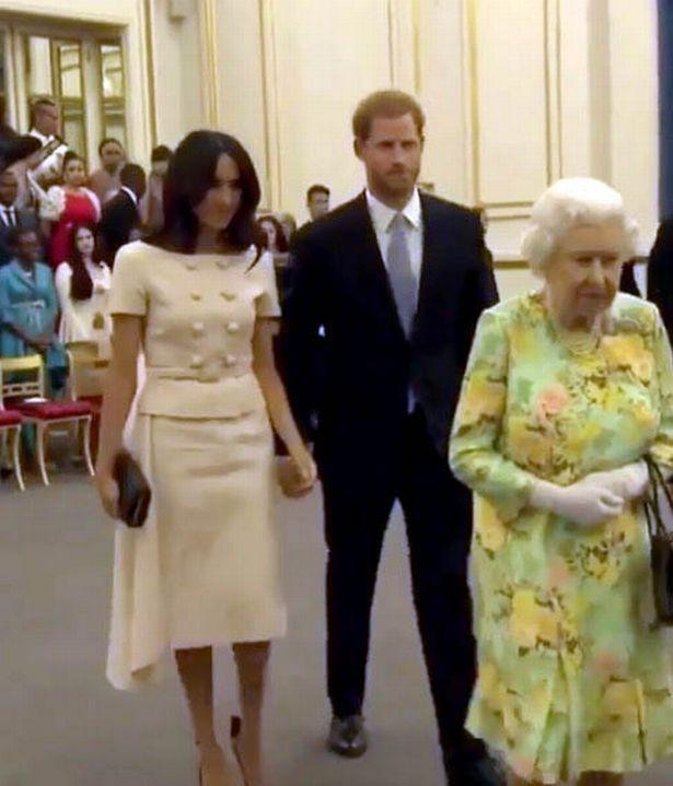  Meghan attempted to hold Prince Harry's hand at the Young Leaders Reception at Buckingham Palace but he was having none of it