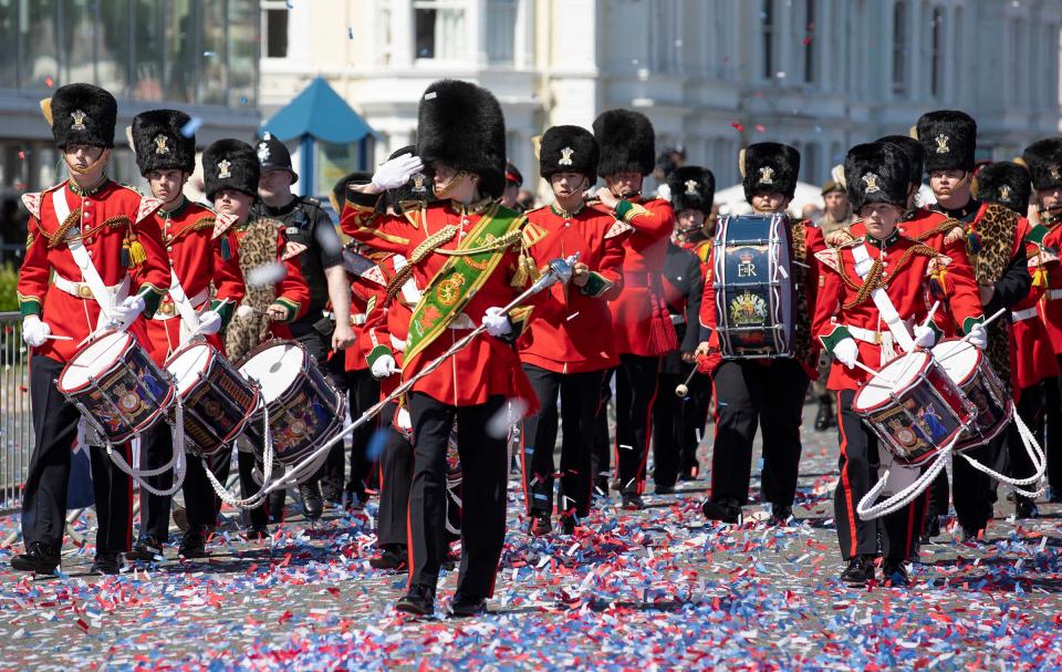 Crowds line the streets to watch the Army band in Wales