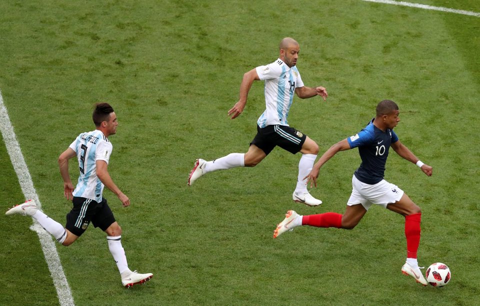  Kylian Mbappe storms past three Argentina players in mid-pitch - before Marcos Rojo brought him down inside the box for a penalty