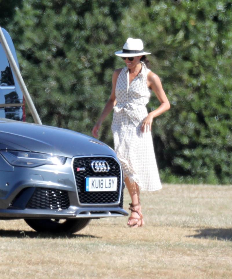  Meghan appeared in high spirits are she beamed in the sunshine in Ascot