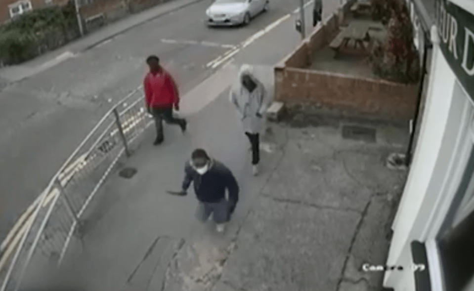  CCTV shows the thugs brandishing a huge machete