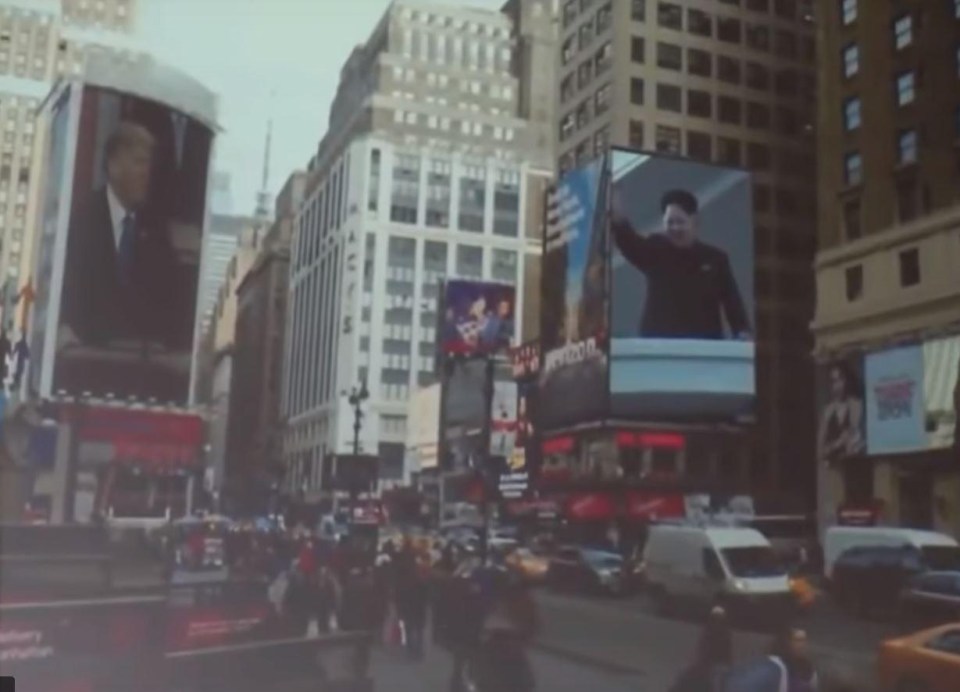 The cheesy film trailer showed what life would be like if North Korea ditched nukes. Here Kim Jong-un and Trump are projected onto Times Square