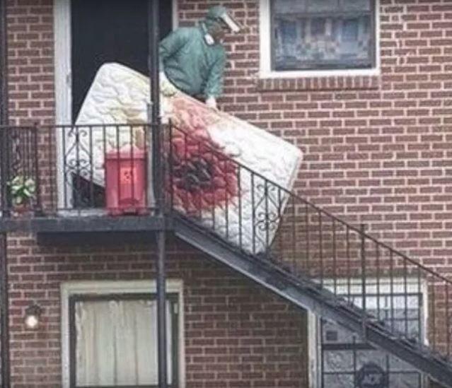  A blood-soaked mattress is removed from Dahmer's apartment by cops in 1991