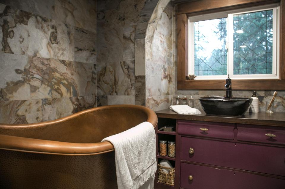  The master bath suite comes with marble styled walls, fully tiled shower and half glass entrance