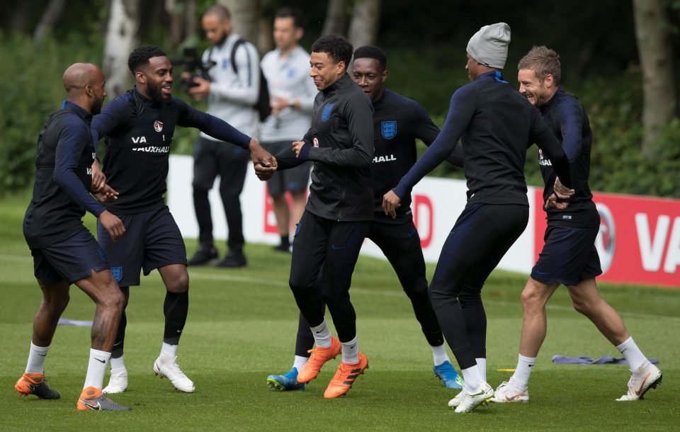  England's finest enjoy a game of Kabaddi with Jesse Lingard in the middle and Rashford still wearing his beanie