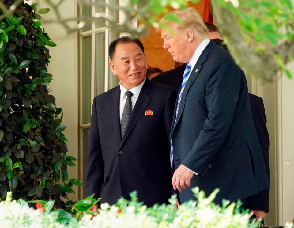  The US President (R) talking with Kim Young Chol