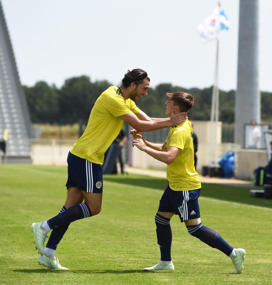  Little Billy Gilmour is towered over by Scotland Under-21s team-mate Fraser Hornby