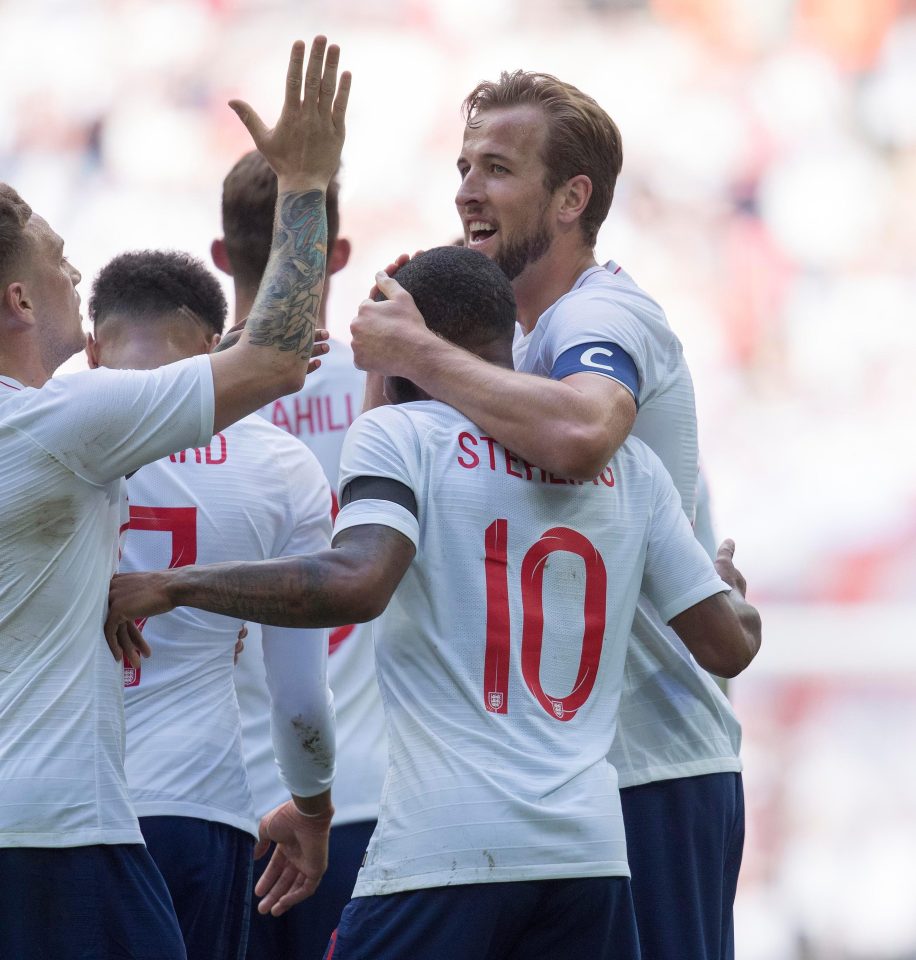  Tottenham striker Kane celebrates with his team-mates after scoring in the friendly