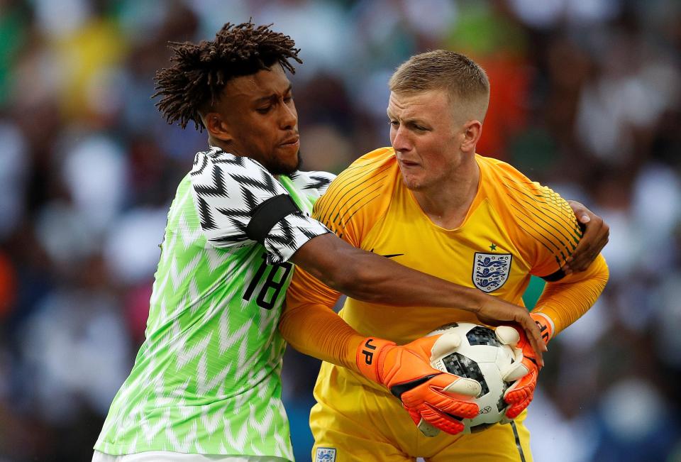  Iwobi attempts to retrieve the ball from Jordan Pickford after scoring