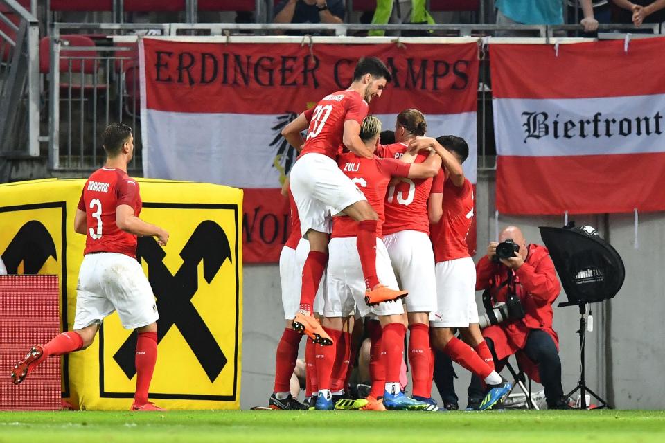  Austria players celebrate after Martin Hinteregger's equaliser