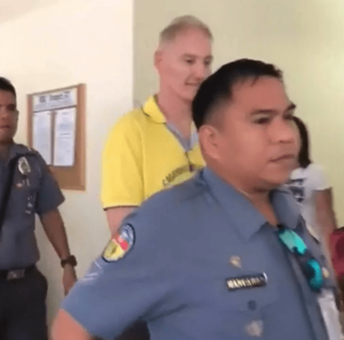  Peter Gerard Scully grins as he leaves court after being jailed for life for numerous child sex crimes