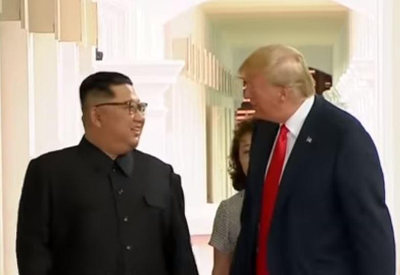 Kim this way... Donald appears to be guiding his North Korean opposite