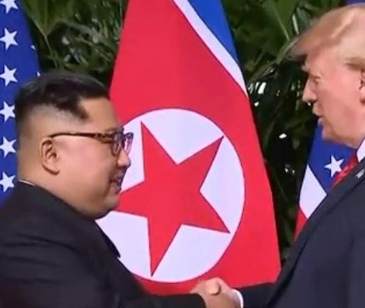 Historic... the moment Kim becomes the first ever North Korean leader to talk face-to-face with a US president