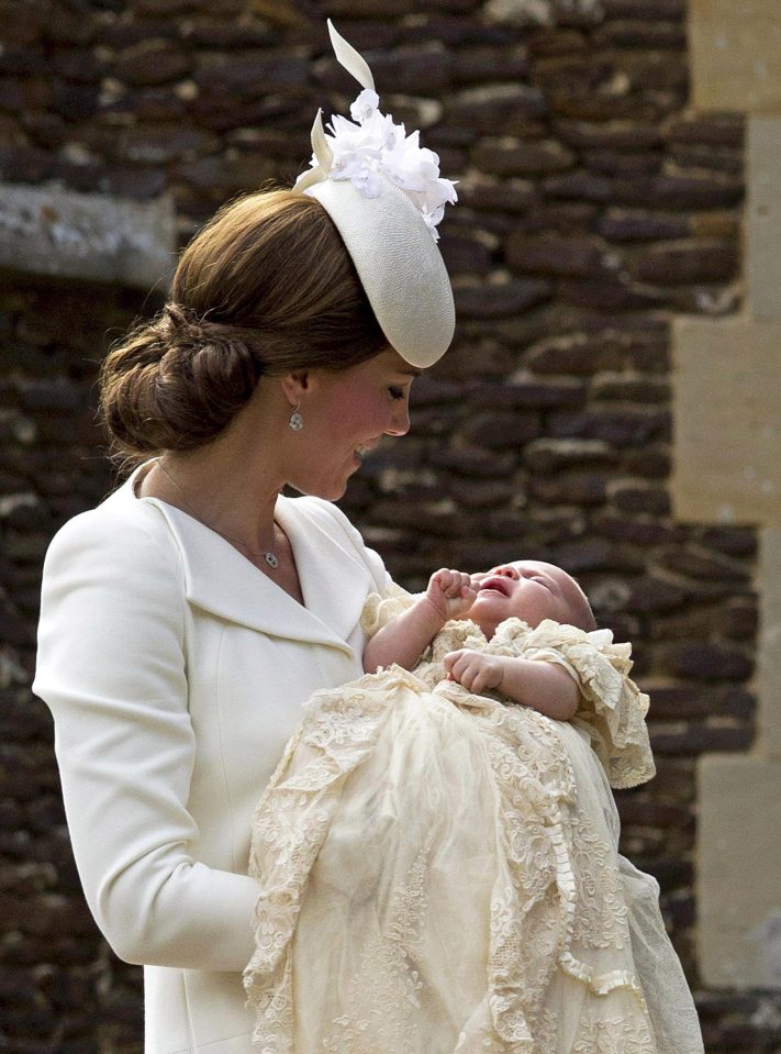  Proud mum Kate cuddles Princess Charlotte on her christening day