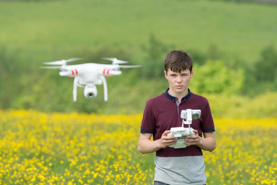  Children could be banned from flying some drones in a safety clampdown being weighed up by the Department for Transport