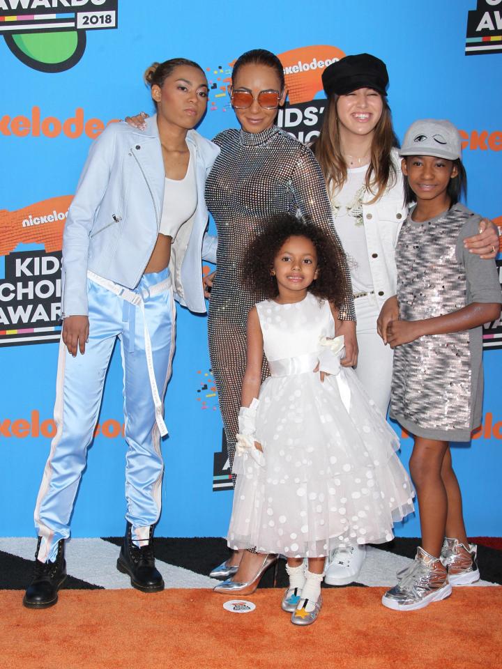  The singer with daughters Phoenix (far left), Angel (far right) and Madison (centre), as well as her ex Stephen Belafonte's daughter Giselle (second from right)