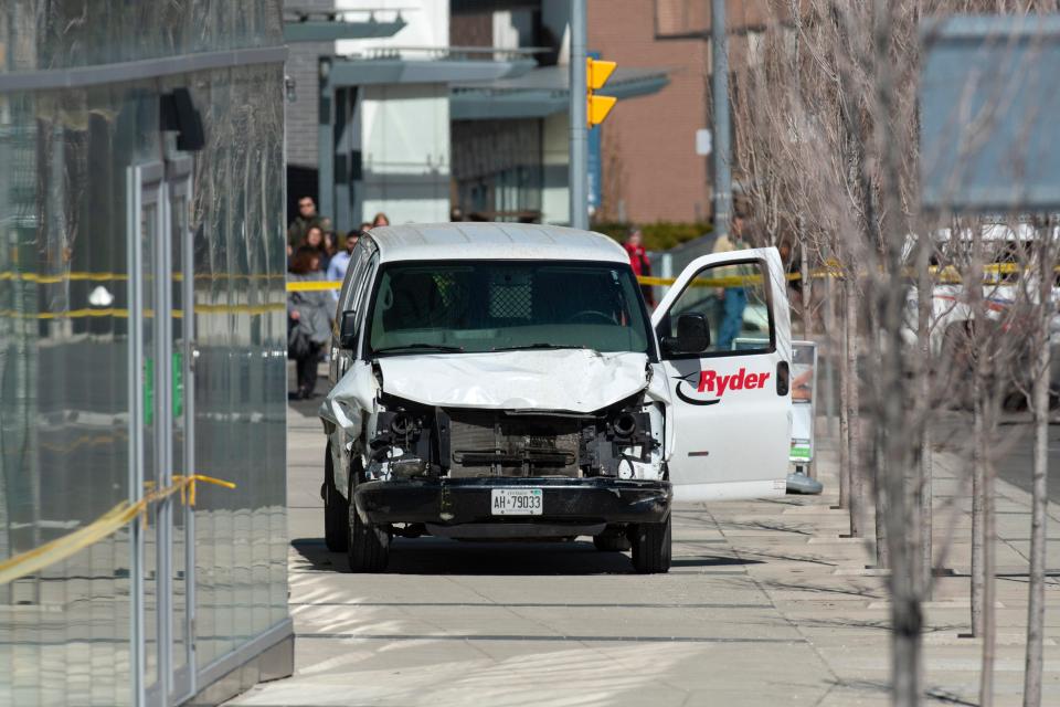  A rented van sits on a pavement about a mile from where several pedestrians were injured in northern Toronto, Canada, 23 April 2018