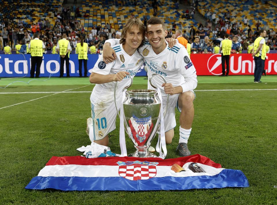  Modric and Mateo Kovacic celebrate in front of the Croatian flag after winning the Champions League with Real Madrid