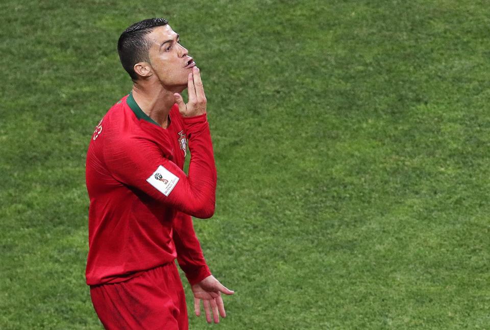  Cristiano Ronaldo grew a beard and stroked his chin - a reference to his 'G.O.A.T' status