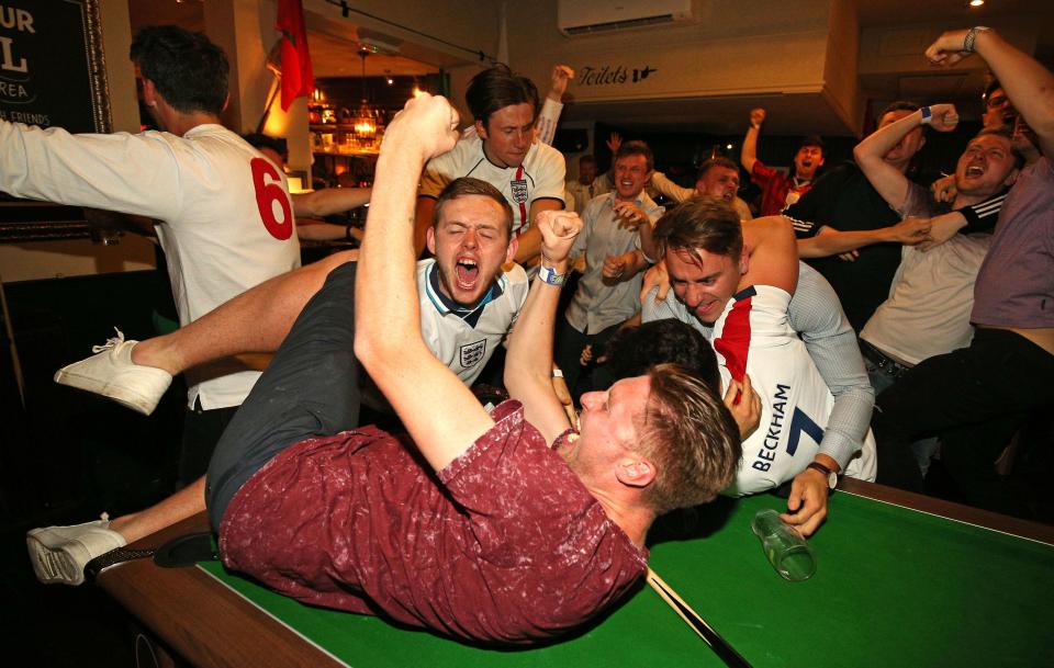  Fans in London celebrate the result of the England and Tunisia game