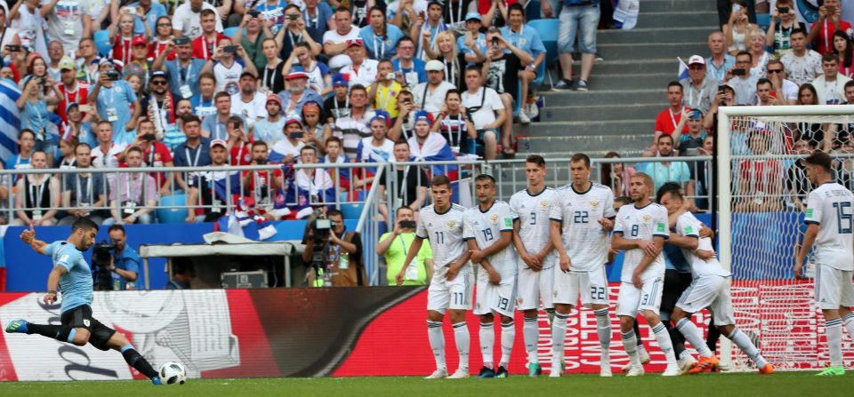  Luis Suarez takes advantage of some ridiculous defending in the wall to score for Uruguay against Russia last week