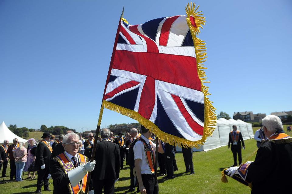 A union flag flutters in the breeze at the Boyne Orange Order parade