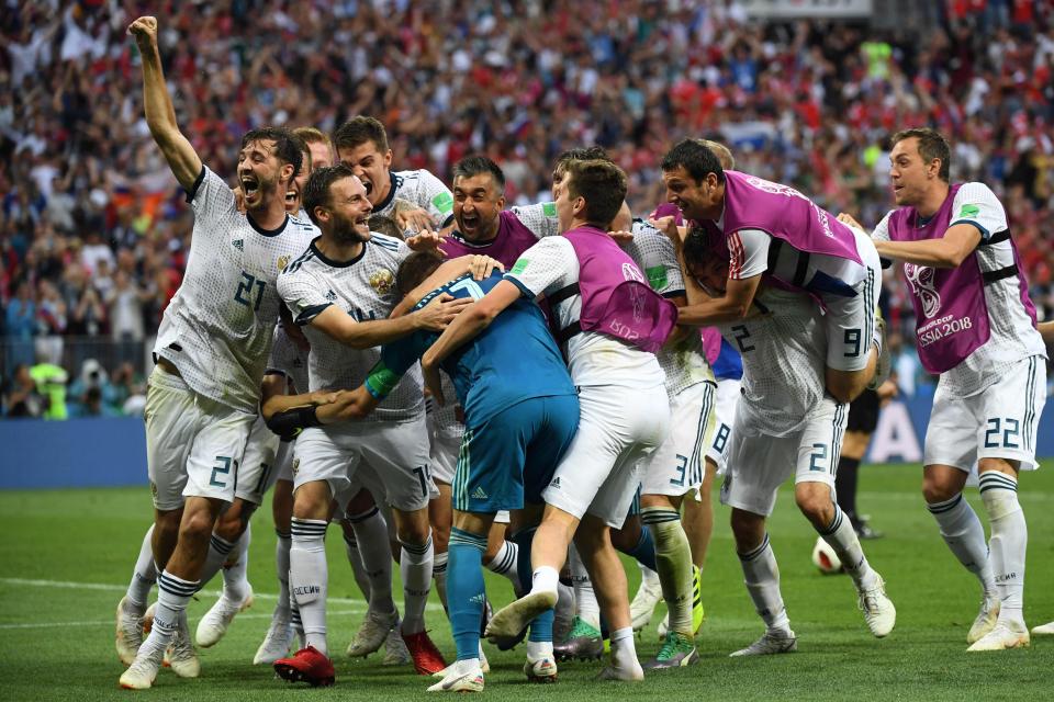  Russia celebrate after reaching the quarter-finals