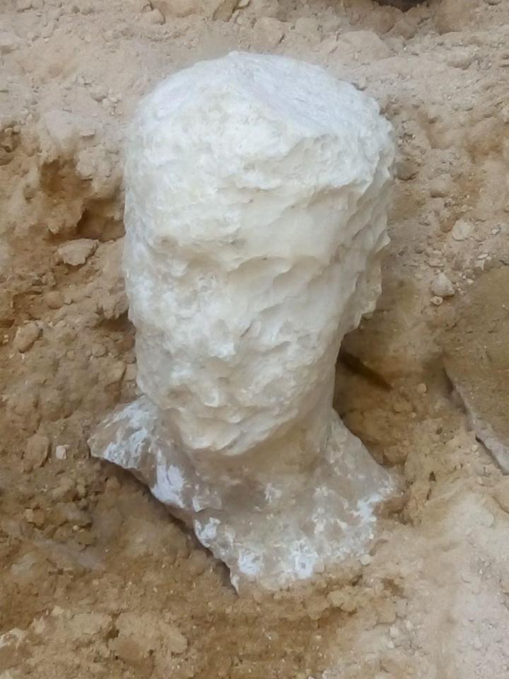  The sarcophagus was found buried alongside a strange alabaster head of an unknown man