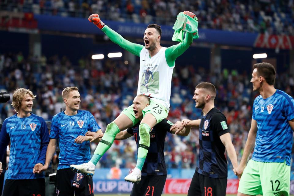  Vida carried Croatia's goalkeeping hero on his shoulders after they went through to the quarter-finals