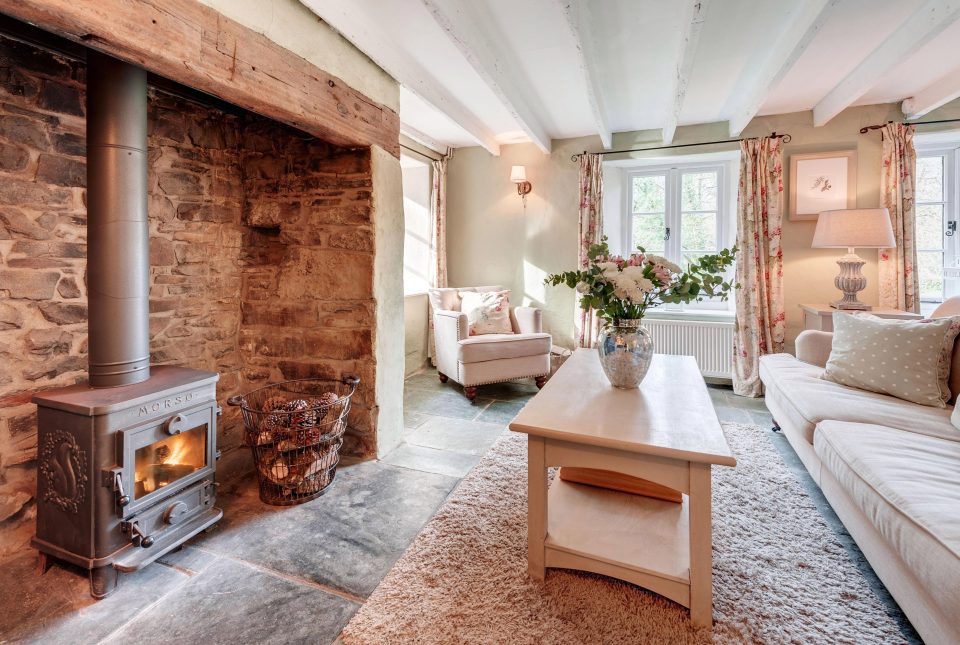  The cottage's features include fireplaces and original beams