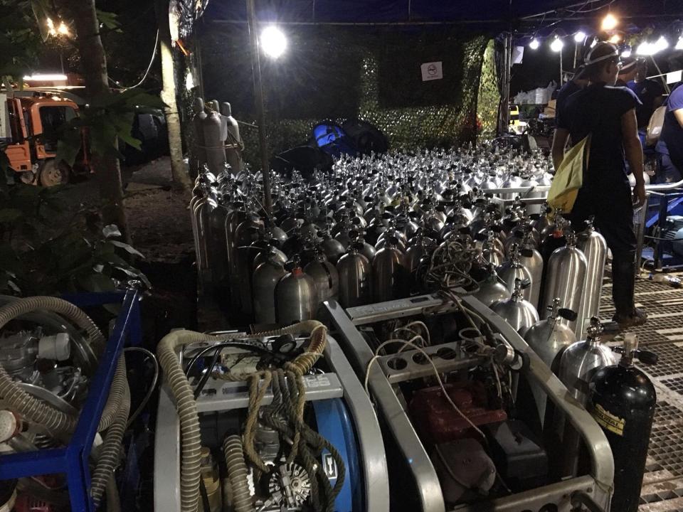  Oxygen tanks are prepared for rescue divers near the entrance of the cave