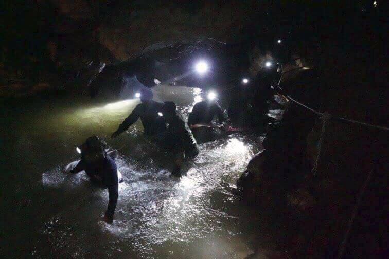  But the operation continues... here Thai navy seals wade through the flooded main passageway into the underground cave network