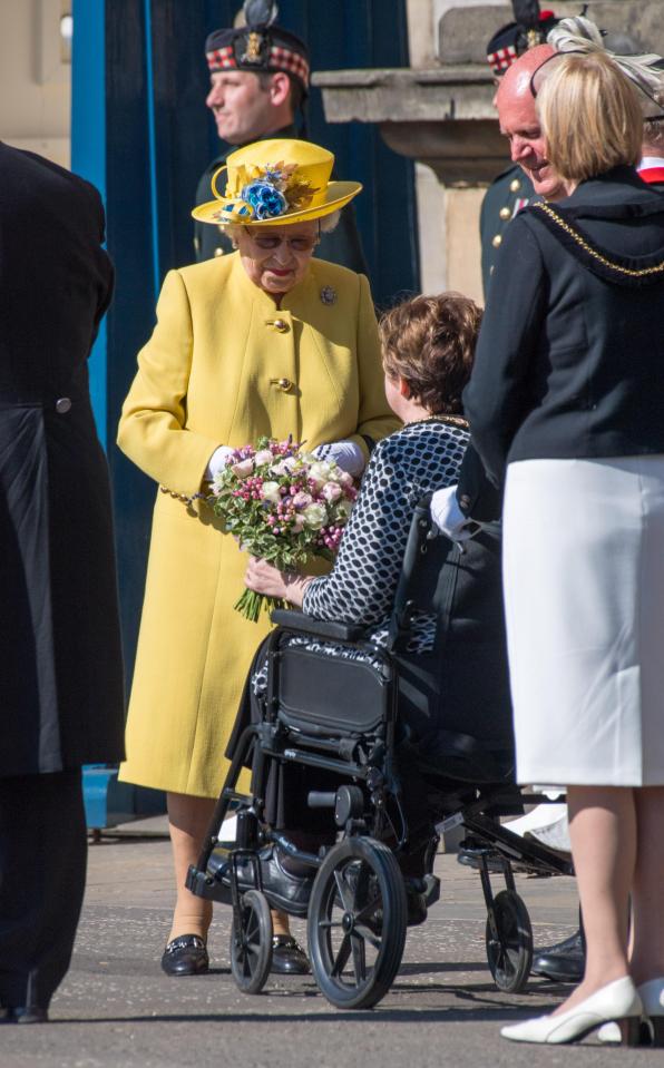  She was seen speaking to a child in a wheelchair outside Holyroodhouse