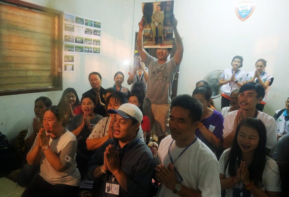  Relatives of the missing boys pray for them after celebrating news of their discovery