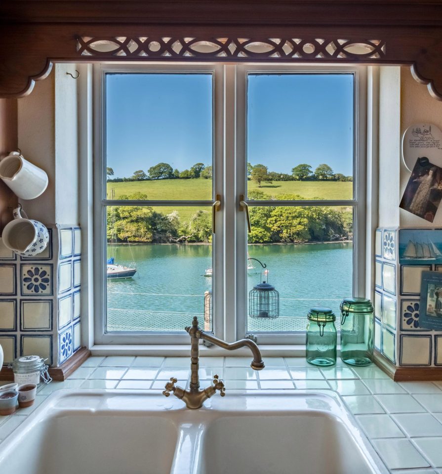  The ground floor kitchen overlooks the calm waters of Mylor Creek