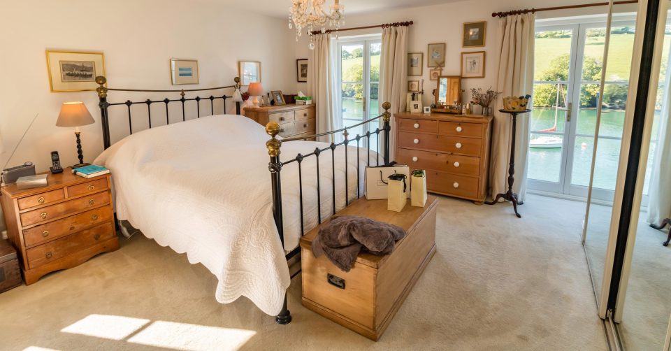  A pair of double doors in a bedroom provide floor-to-ceiling views