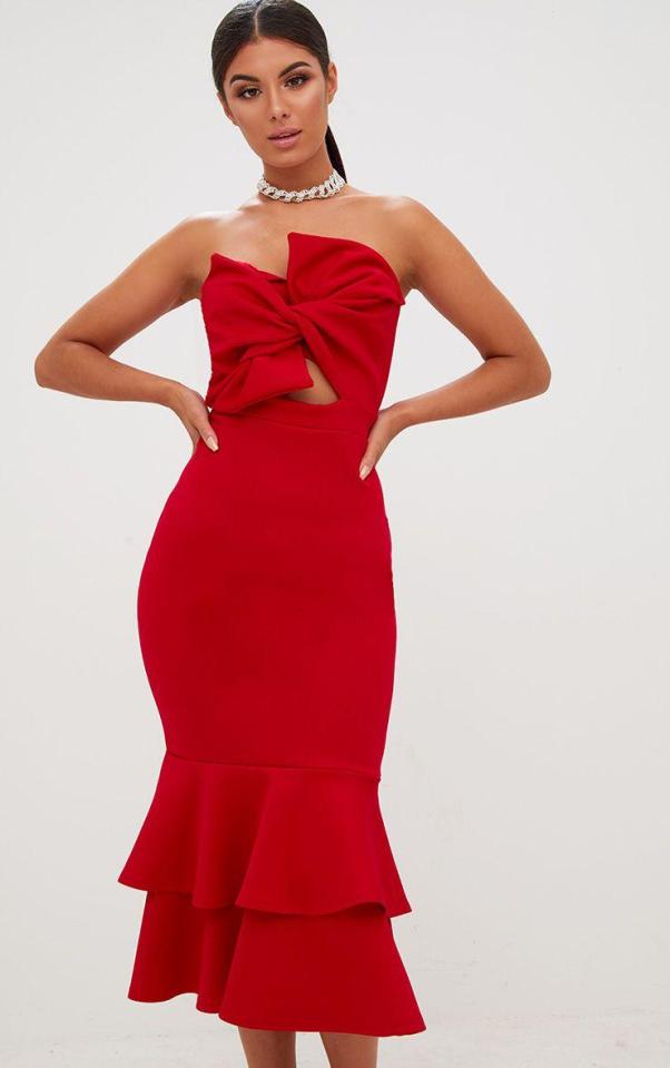  A bold red dress with a frill hem is a girly dress that makes a statement