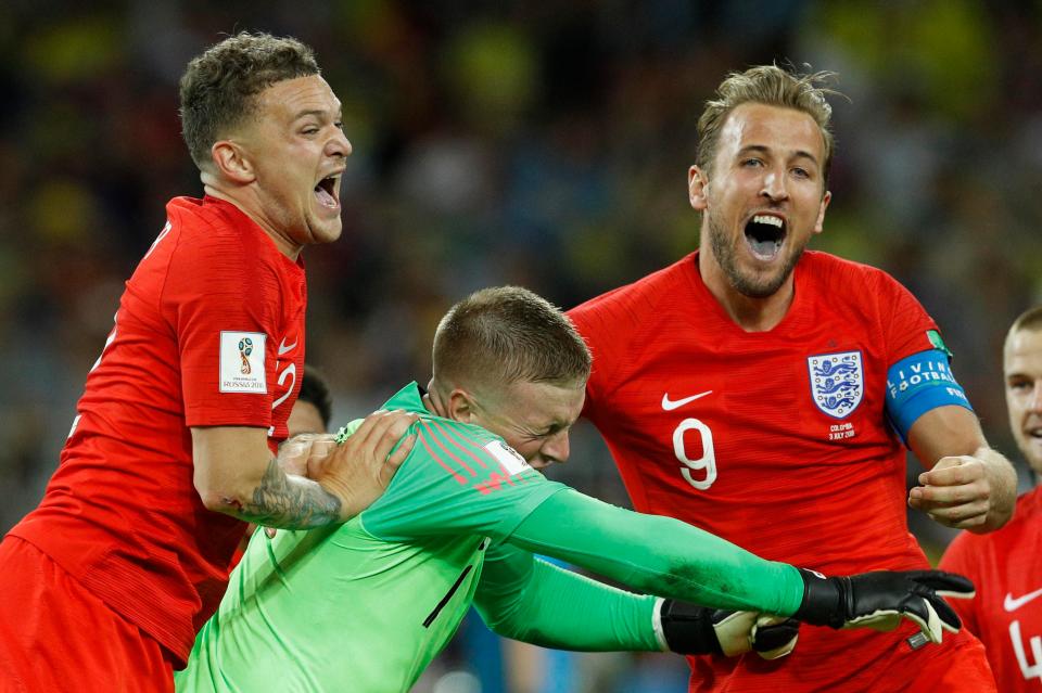  Pickford was mobbed by his England teammates after the spot-kick win