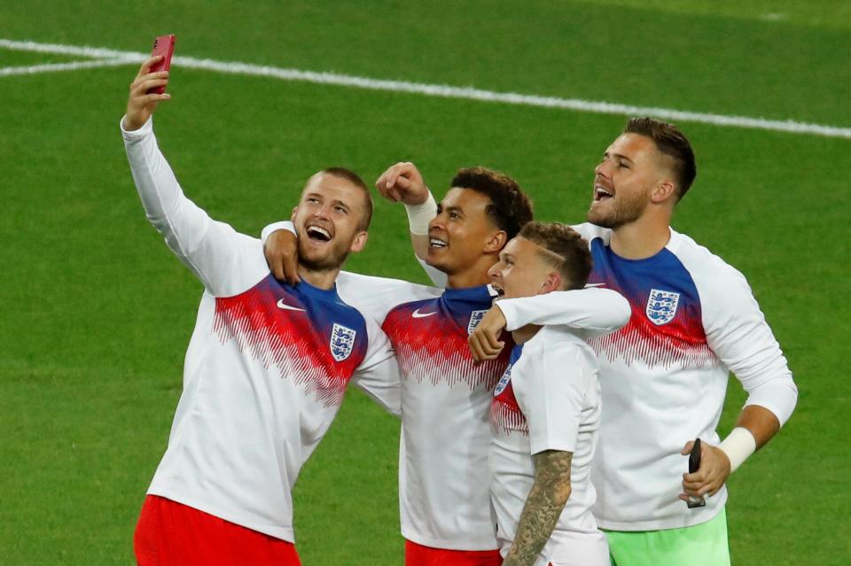  England players celebrate in training tops after the penalty shootout win over Colombia