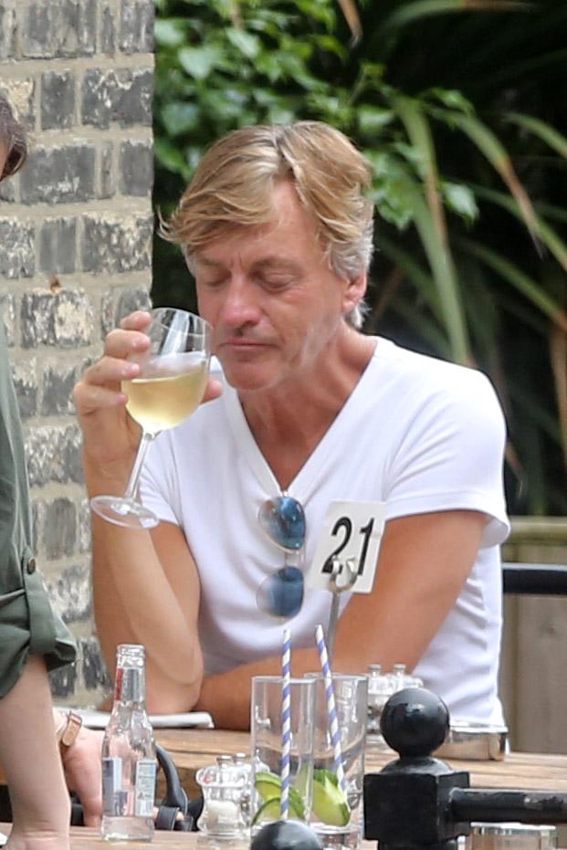  Richard enjoyed a well-deserved glass of chilled white wine during a solo outing in London yesterday