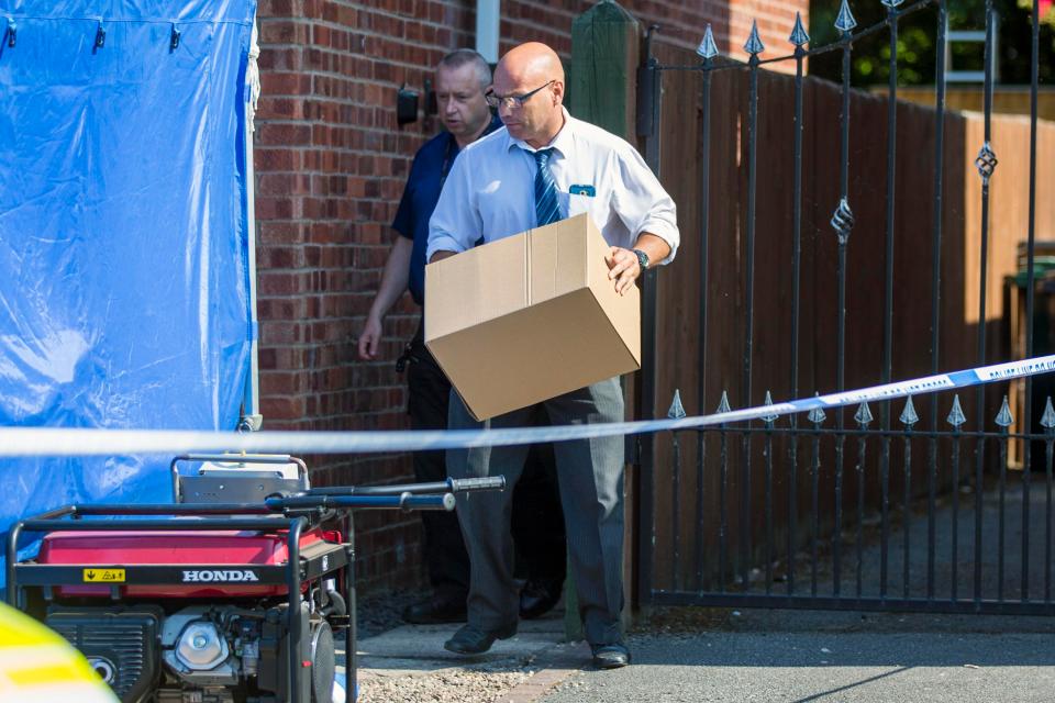  Some removed boxes from the house as cops continue to quiz the nurse