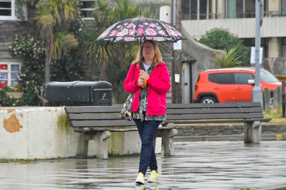  Brits in the south will need to have their brollies at the ready tomorrow. This woman needed it in Dorset today