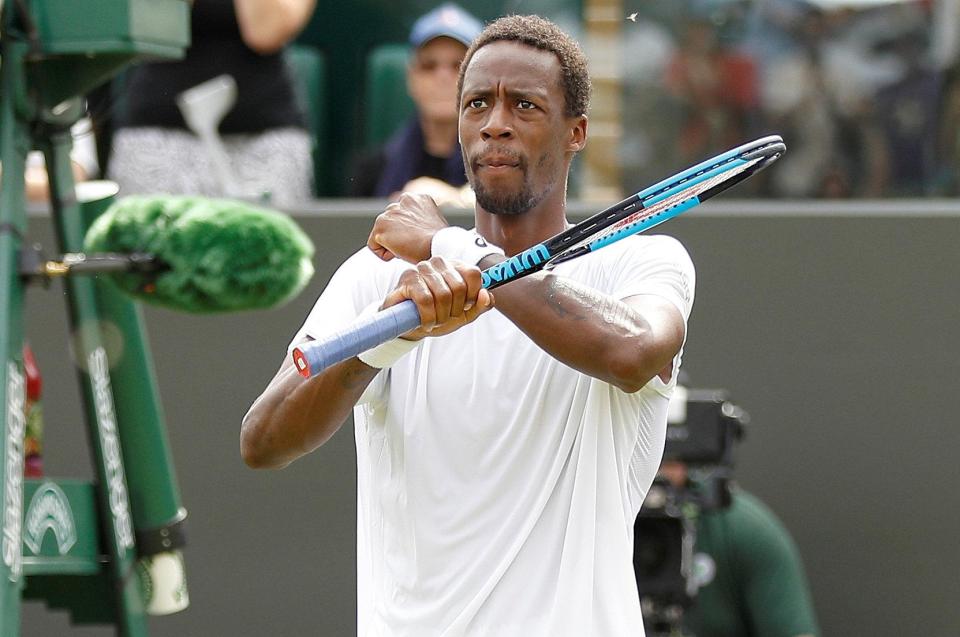  Gael Monfils does the Black Panther salute for the crowd