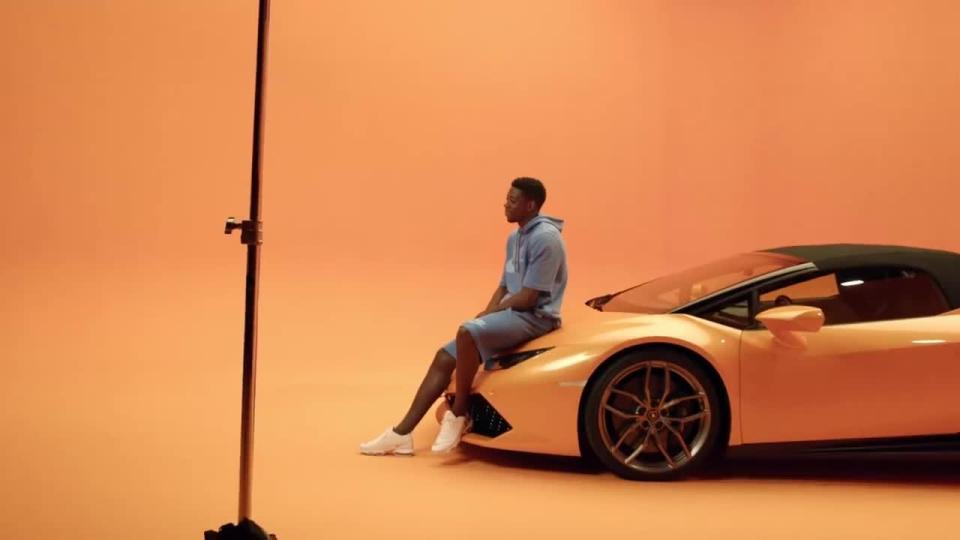  Dembele features in photoshoots posing with flashy cars