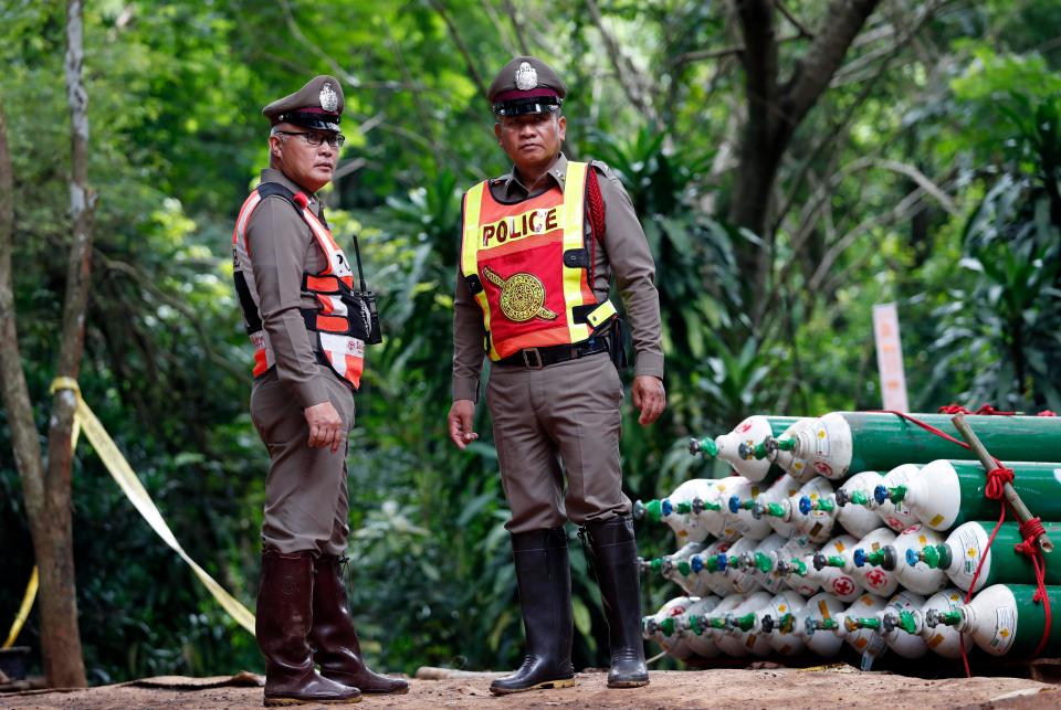  Thai police at the command centre near the cave