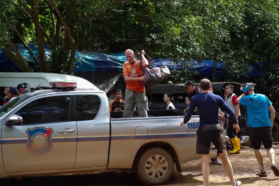  Brit caver Vernon Unsworth, centre, gets out of a pick up truck near the Tham Luang cave complex during the rescue operation